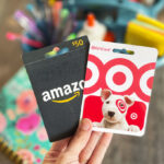 Hand holding 2 Gift Cards for back to school giveaway