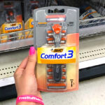 Hand holding BIC Comfort 3 Disposable Razor Kit