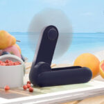 Handheld Mini Fan in Dark Blue Color on the Table