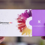 Hands holding MyHeritage DNA Kit