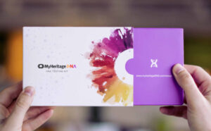 Hands holding MyHeritage DNA Kit