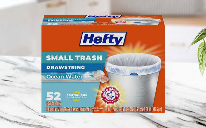 Hefty 4 Gallon 52 Count Small Trash Bags in the Ocean Water Scent on a Kitchen Counter