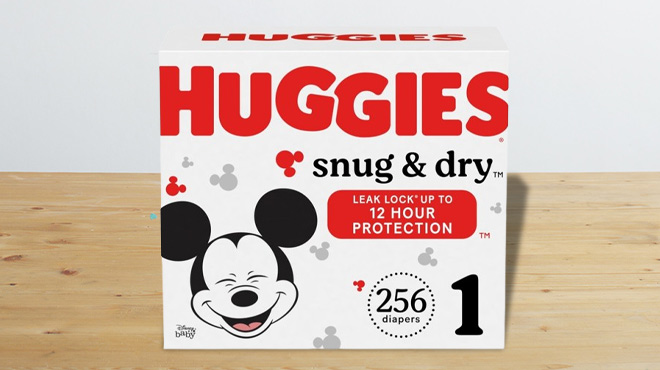 Huggies Snug Dry Diapers 256 Count on a Table