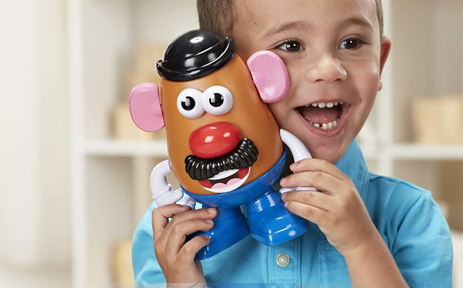 Kid Playing with Potato Head Classic Toy