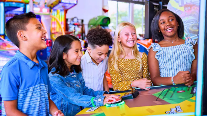 Kids Playing Games at Chuck E. Cheese