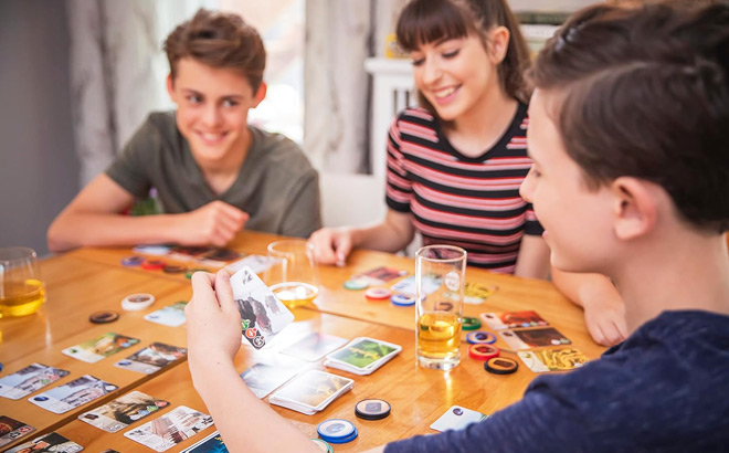 Kids Playing Splendor Board Game