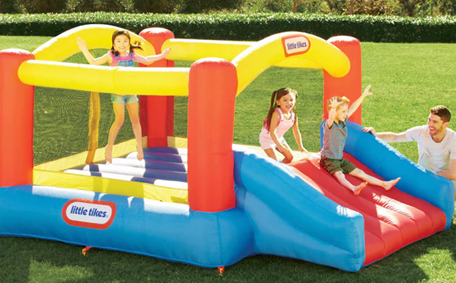 Kids Playing in Little Tikes Jump n Slide Inflatable Bouncer