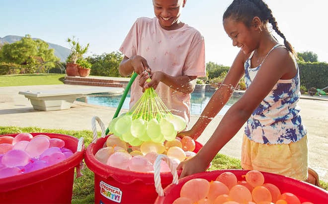 Kids Playing with Bunch O Balloons Tropical Party