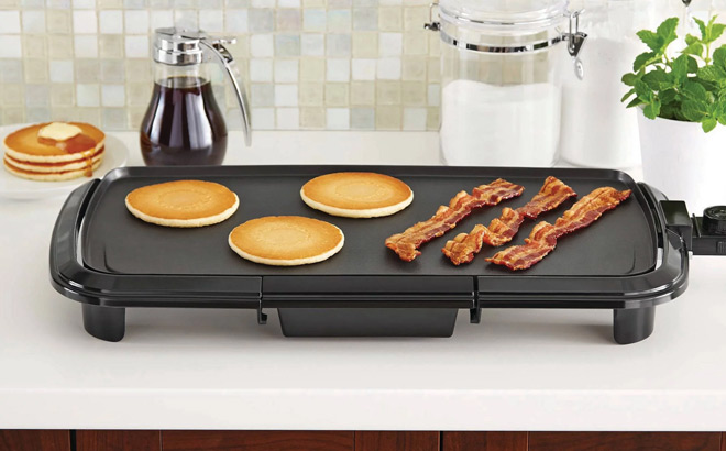 Mainstays Dishwasher Safe Black Griddle with Adjustable Temperature Control on the Table