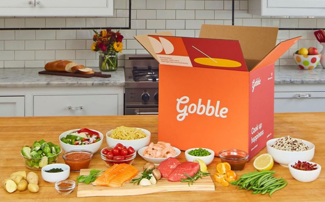 Opened Gobble Box on a Kitchen Counter next to Fresh Foods