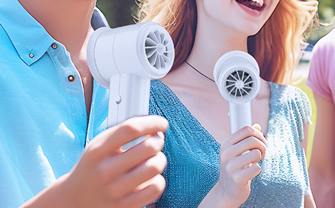 People Holding Portable Handheld Fan