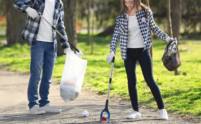 People Picking Trash Using a Grabber Reacher Tool