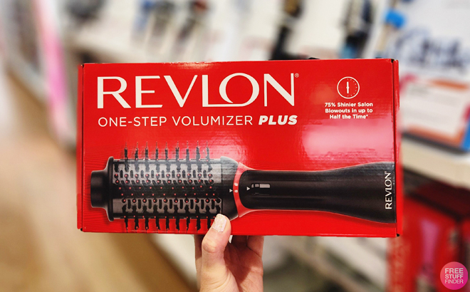 Person Holding Revlon One Step Volumizer Brush in a Store