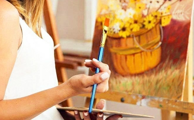 Person Holding an Acrylic Paint Brush