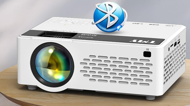 TMY Mini Bluetooth Projector with Screen on a Table