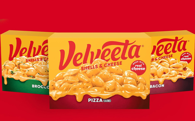 Three Boxes of Velveeta Shells & Cheese on a Red Background