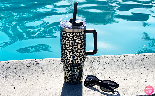 Tumbler next to Sunglasses by the Pool