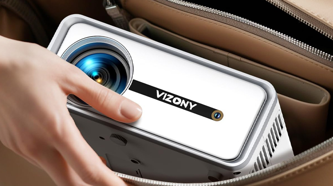 A Person Putting a Vizony Mini Projector in a Bag