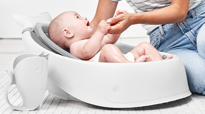 a Baby in a Skip Hop Baby Bath Tub