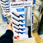 a Person Holding Cuisinart 10 Piece Cutlery Set with Stainless Steel End Caps