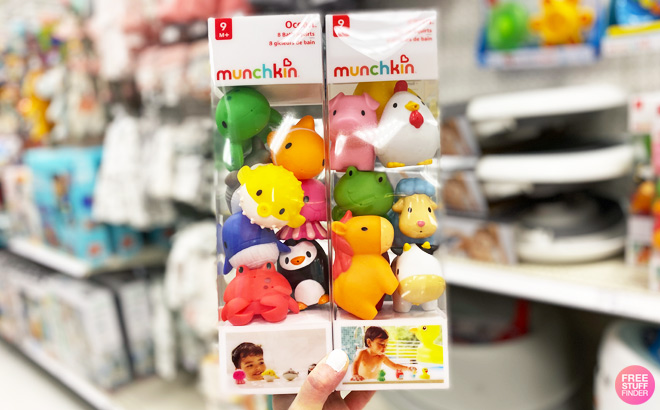 a Person Holding Munchkin Bath Toys