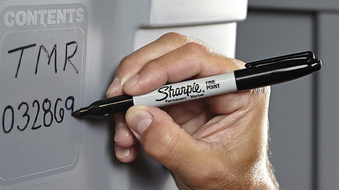 a Person Using Sharpie Permanent Markers