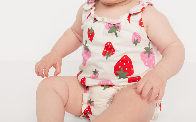 A Baby Girl Wearing Old Navy Sleeveless Tie Shoulder One Piece Romper