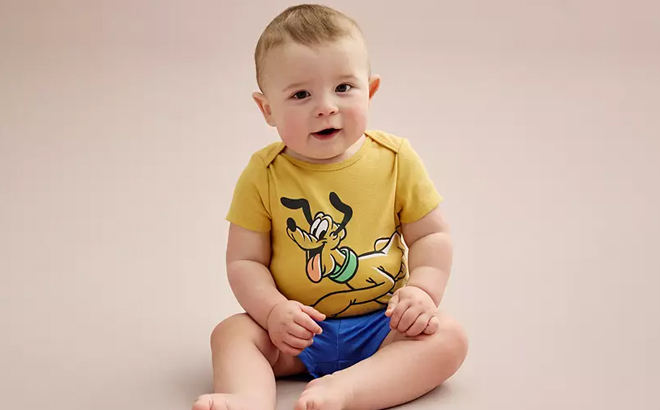 A Baby Wearing Disneys Pluto Bodysuit