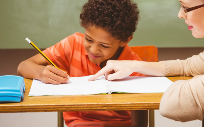 A Boy Learning and Smiling