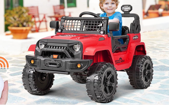 A Boy Riding an Electric Ride on Truck