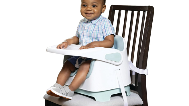 A Boy Seated on a Monbebe Bobbi Feeding Booster Seat