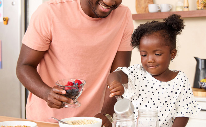 A Father and Daughter Making a Snack