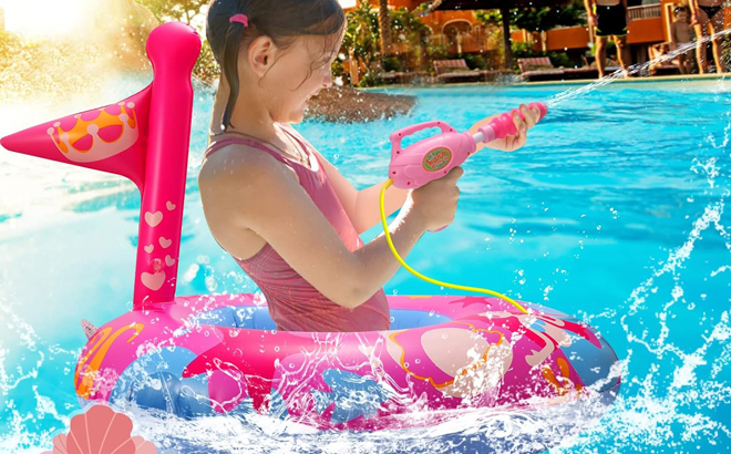 A Girl Playing in a Pool Using a Pool Float with Water Gun