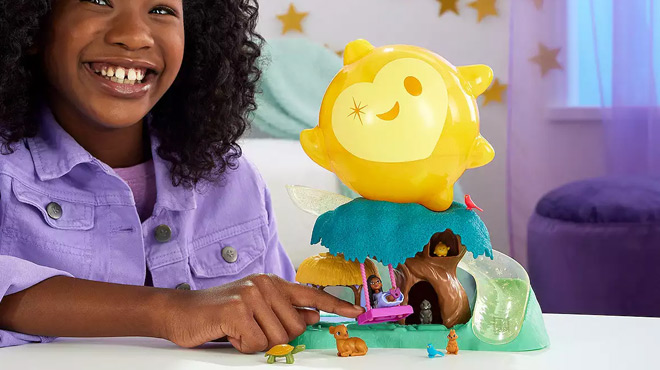 A Girl Playing with Disneys Wish Magical Star Playset