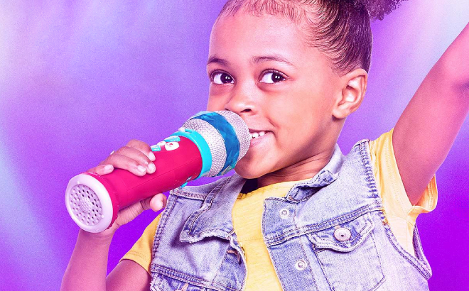 A Girl Singing Using Battat Musical Light Show Microphone Music Toy