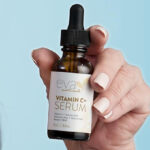 A Hand holding Eva Naturals Vitamin C Face Serum