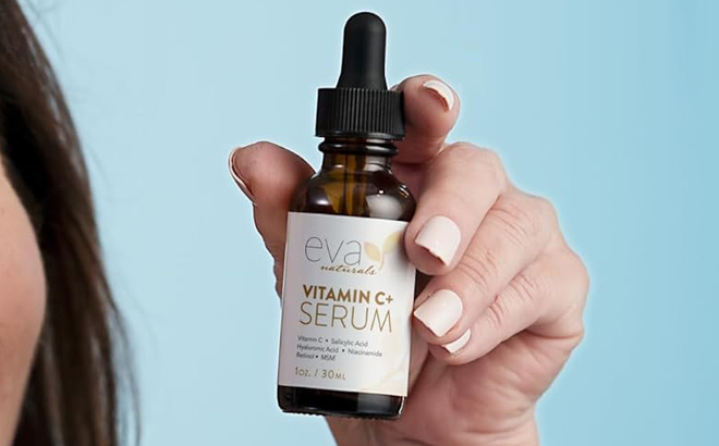 A Hand holding Eva Naturals Vitamin C Face Serum