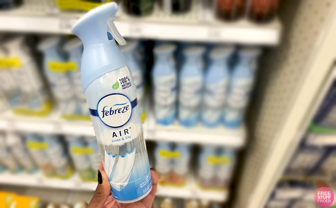 A Person Holding Febreze Linen and Sky Scent Air Freshener Spray 