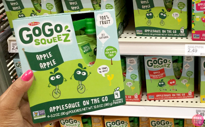 A Hand holding GoGo squeeZ Snack Pouches 4 Pack