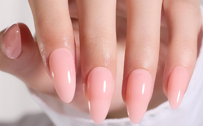 A Hand with Beetles Gel Almond Shaped Press On Nails in Neutral Pink Color