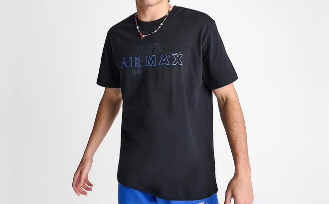 A Man Wearing Nike Air Max Futura Graphic T Shirt