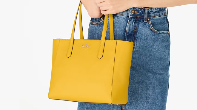 A Person Carrying a Kate Spade Staci Medium Tote