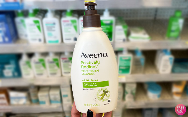 A Person Holding Aveeno Positively Radiant Brightening Facial Cleanser