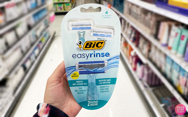 A Person Holding BIC EasyRinse Anti Clogging Womens Disposable Razors