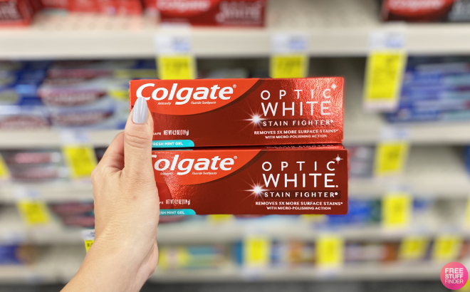 A Person Holding Colgate Optic White Whitening Toothpaste