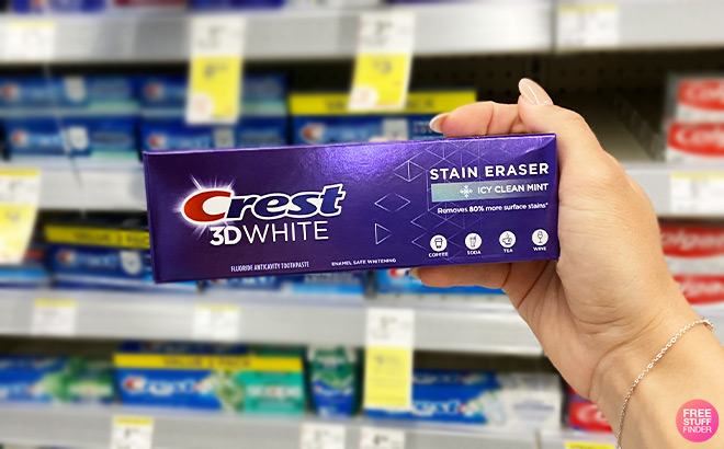 A Person Holding Crest 3D White Toothpaste
