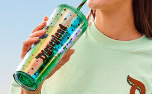 A Person Holding Disney Eats Ice Cream Sandwich Starbucks Tumbler