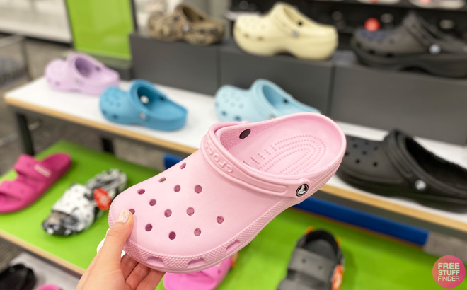 A Person Holding Light Pink Crocs Baya Clog