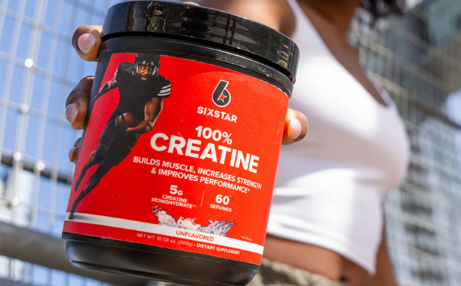 A Person Holding Six Star Elite 100 Creatine Monohydrate Powder