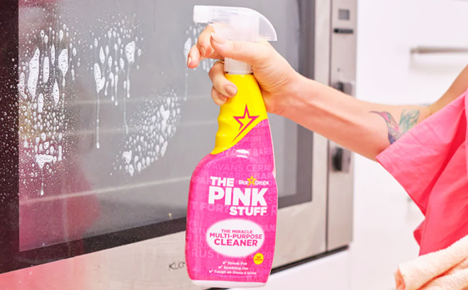 A Person Holding The Pink Stuff Miracle Multi Purpose Cleaner Spray